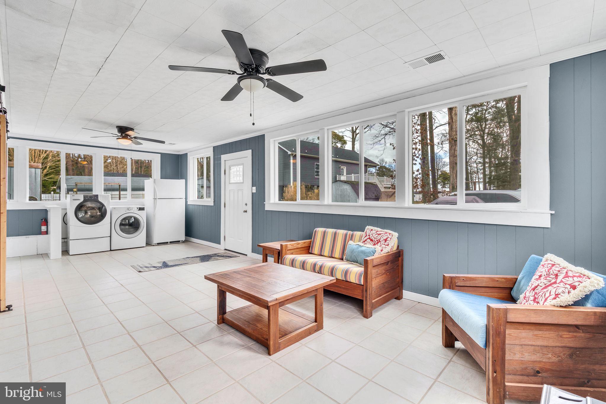 239 Lane Road Reedville, VA 22539 - Photo 12 of 43 Bright and airy sunroom retreat.