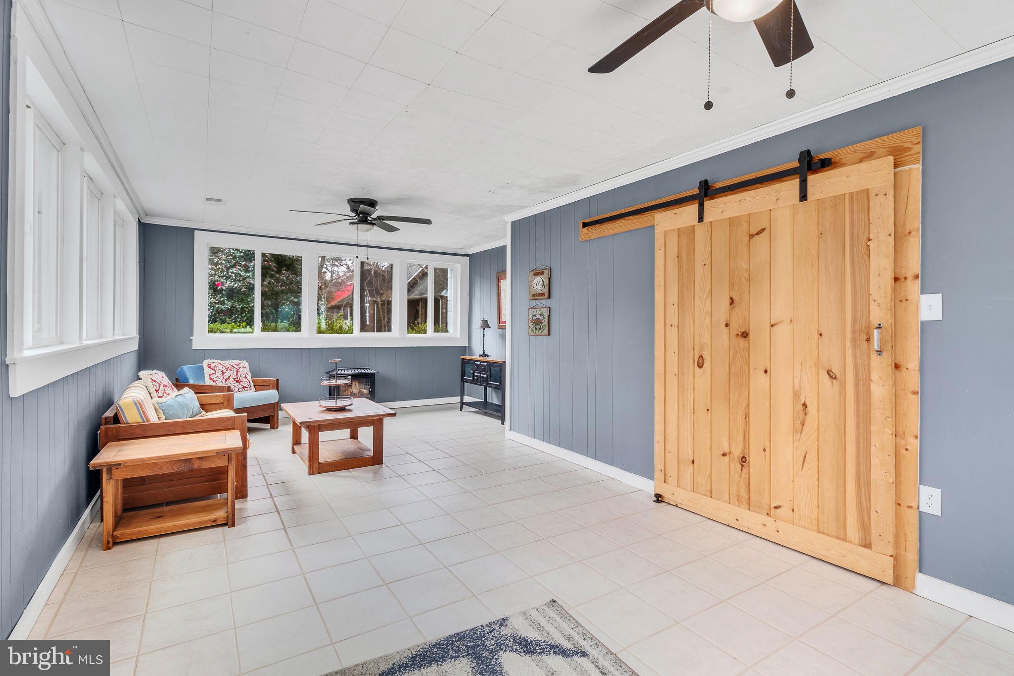 239 Lane Road Reedville, VA 22539 - Photo 13 of 43 Charming sunlit space with rustic flair.