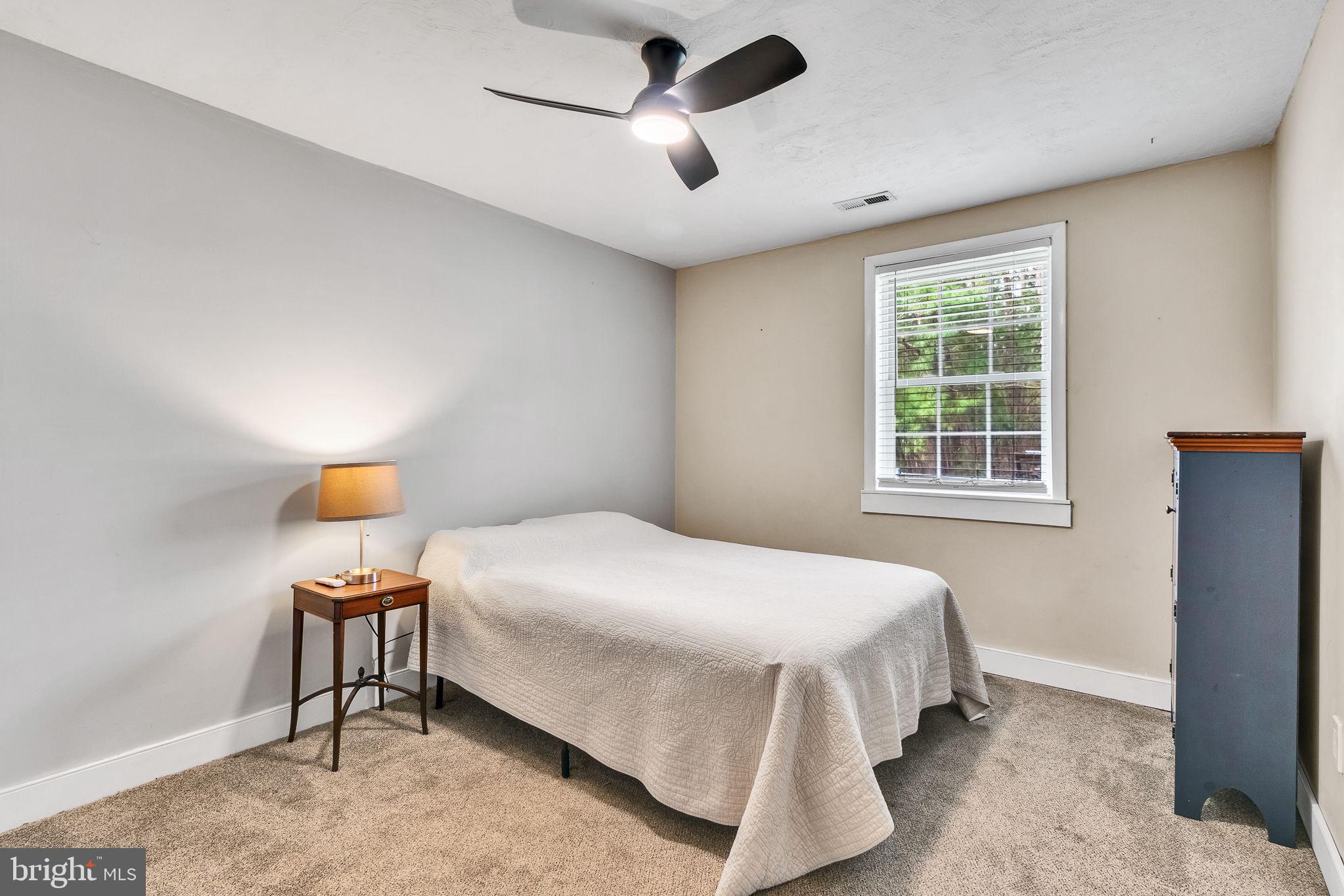 239 Lane Road Reedville, VA 22539 - Photo 25 of 61 a bedroom with a bed and a window