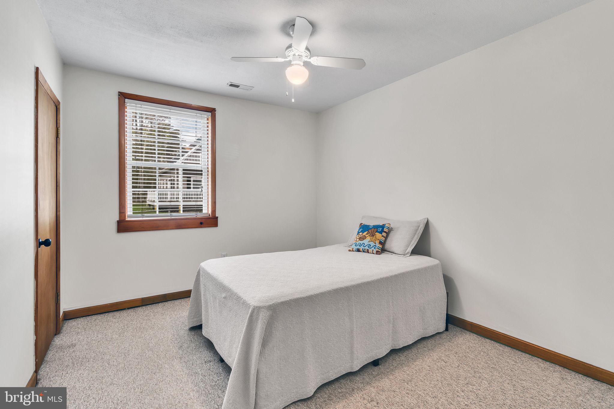 239 Lane Road Reedville, VA 22539 - Photo 26 of 43 Bright and inviting bedroom retreat.