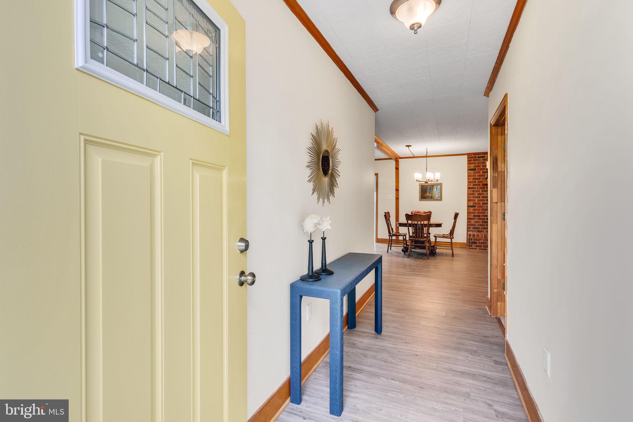 239 Lane Road Reedville, VA 22539 - Photo 29 of 61 a view of a hallway view with wooden floor and furniture
