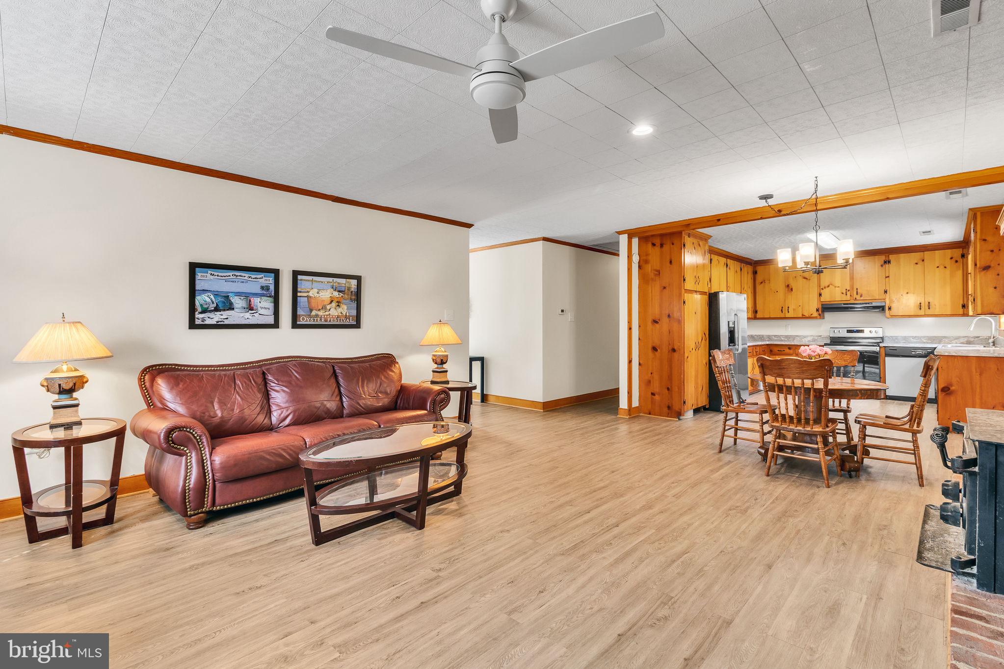 239 Lane Road Reedville, VA 22539 - Photo 3 of 61 a living room with furniture and a wooden floor
