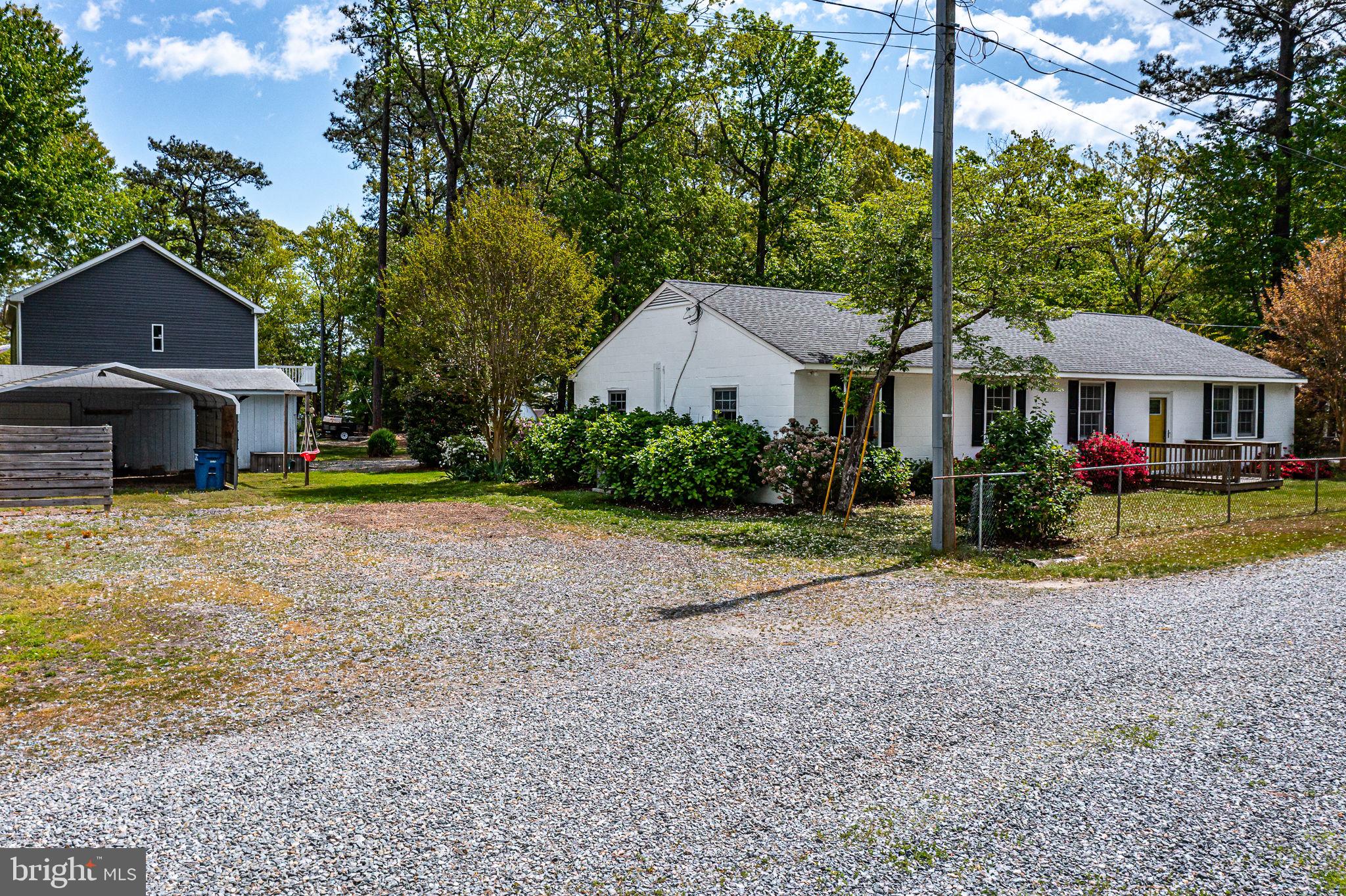 239 Lane Road Reedville, VA 22539 - Photo 37 of 61 a front view of a house with garden