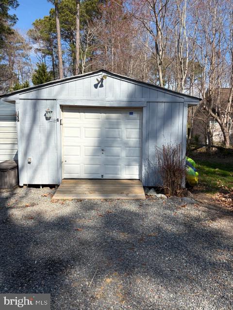 239 Lane Road Reedville, VA 22539 - Photo 38 of 43 Charming garage nestled in nature.