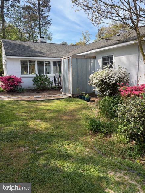 239 Lane Road Reedville, VA 22539 - Photo 40 of 43 Charming garden retreat with blooms.