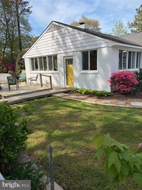 239 Lane Road Reedville, VA 22539 - Photo 41 of 43 Charming home with vibrant garden blooms.