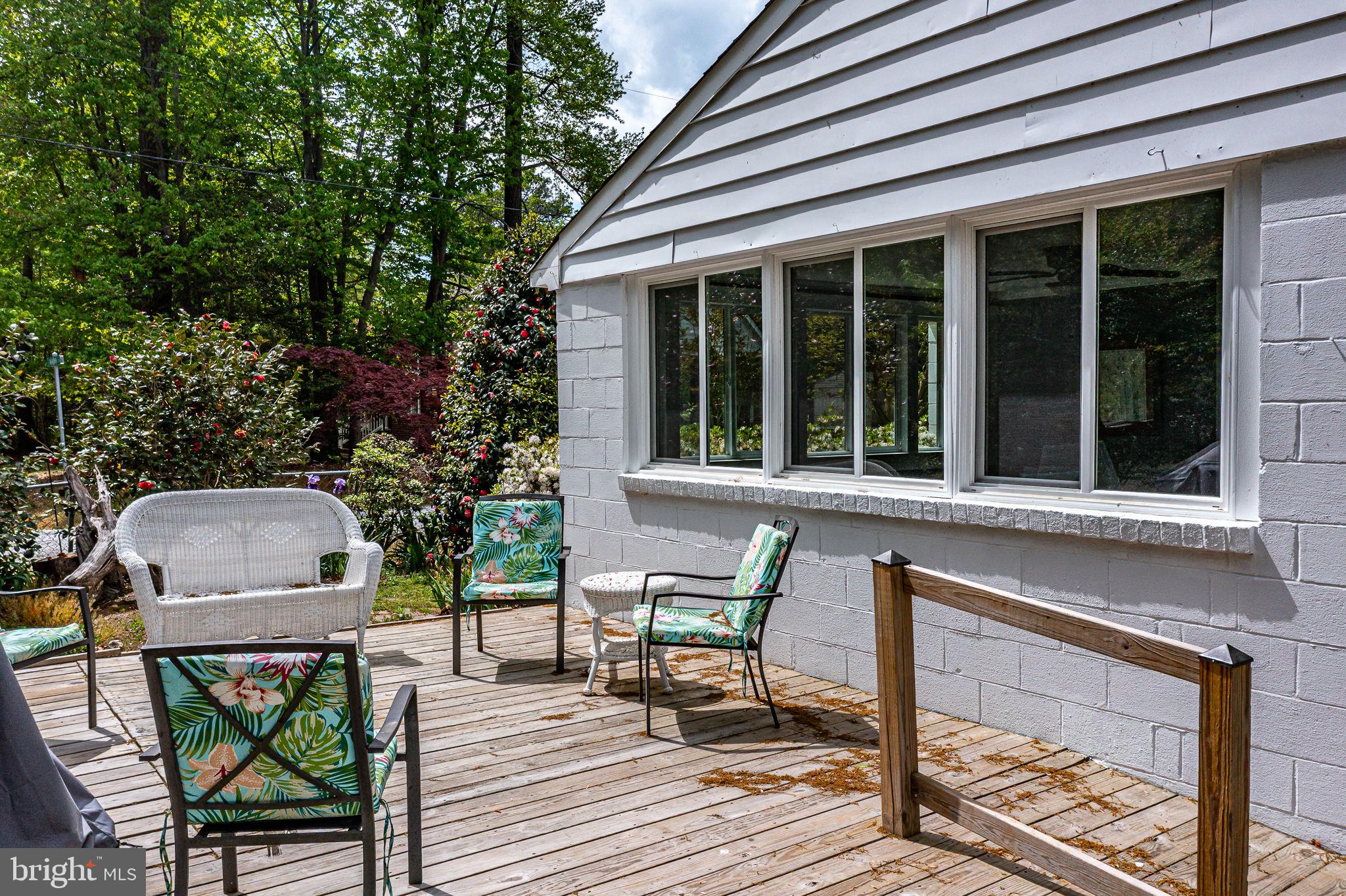239 Lane Road Reedville, VA 22539 - Photo 46 of 61 Charming deck surrounded by greenery.