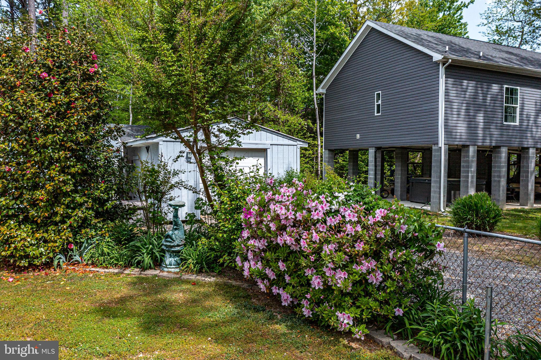 239 Lane Road Reedville, VA 22539 - Photo 48 of 61 a view of a house with a garden