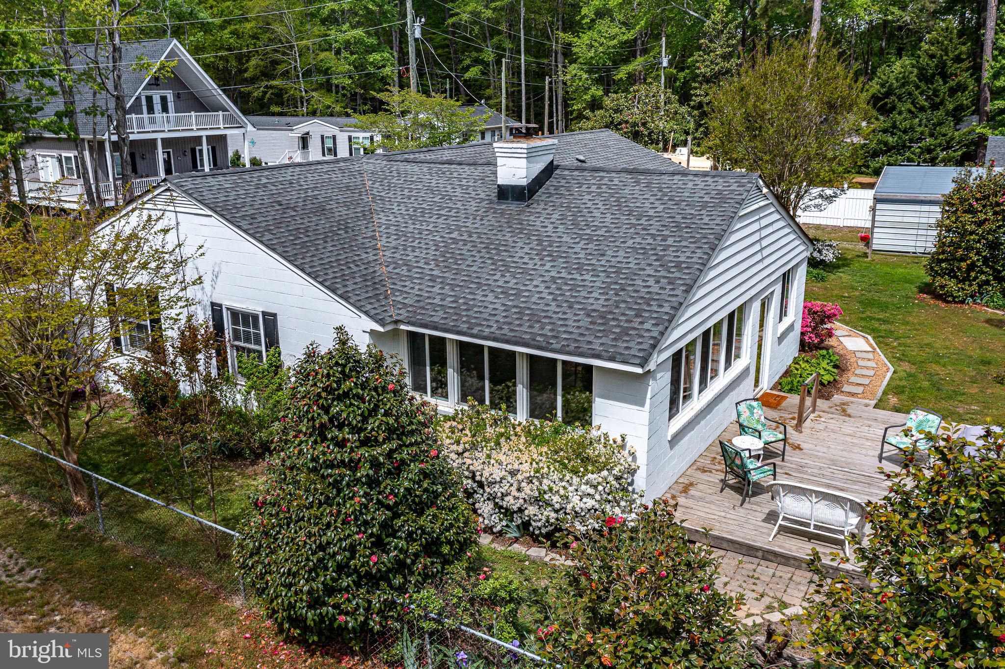 239 Lane Road Reedville, VA 22539 - Photo 50 of 61 an aerial view of house with yard outdoor seating and barbeque oven