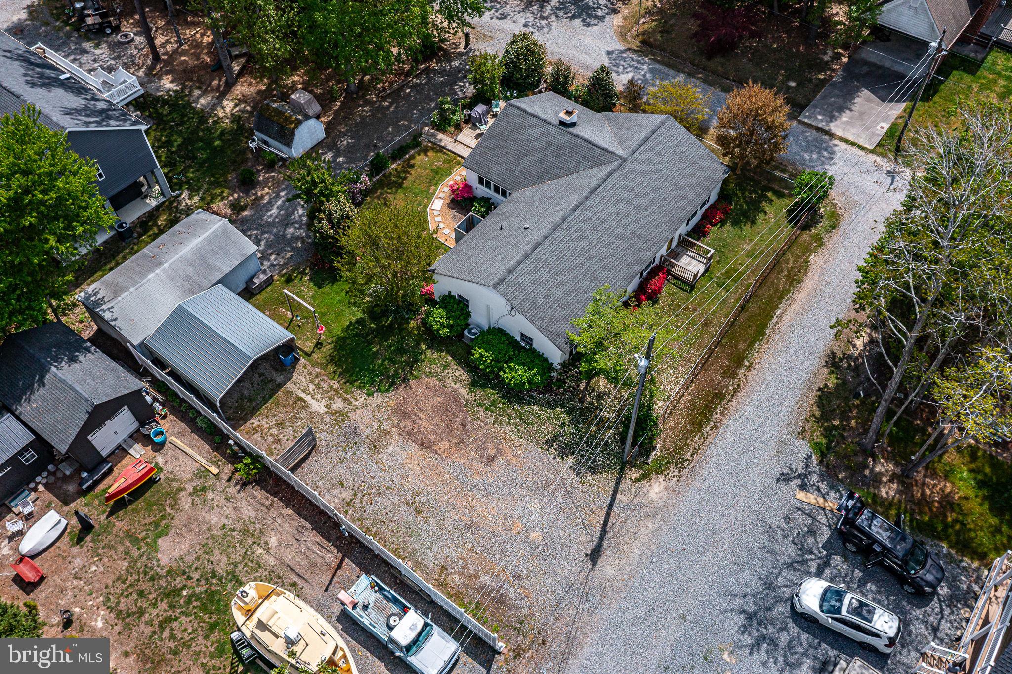 239 Lane Road Reedville, VA 22539 - Photo 55 of 61 an aerial view of a house with a yard and a lot of flower plants