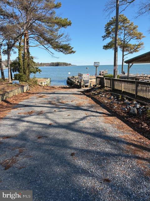 239 Lane Road Reedville, VA 22539 - Photo 57 of 61 Serene lakeside pathway awaits adventure.