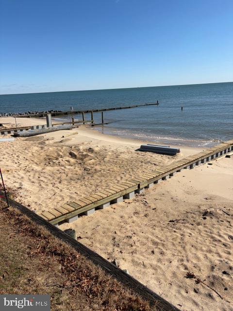 239 Lane Road Reedville, VA 22539 - Photo 60 of 61 Serene shoreline with wooden dock.