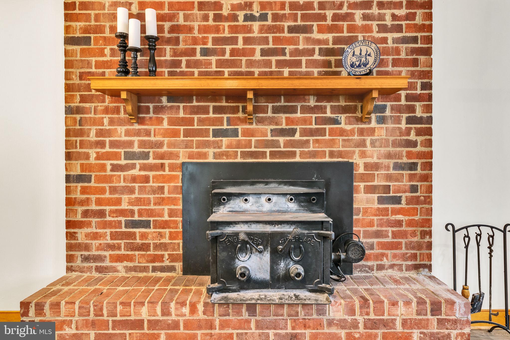 239 Lane Road Reedville, VA 22539 - Photo 6 of 43 Charming brick fireplace centerpiece.