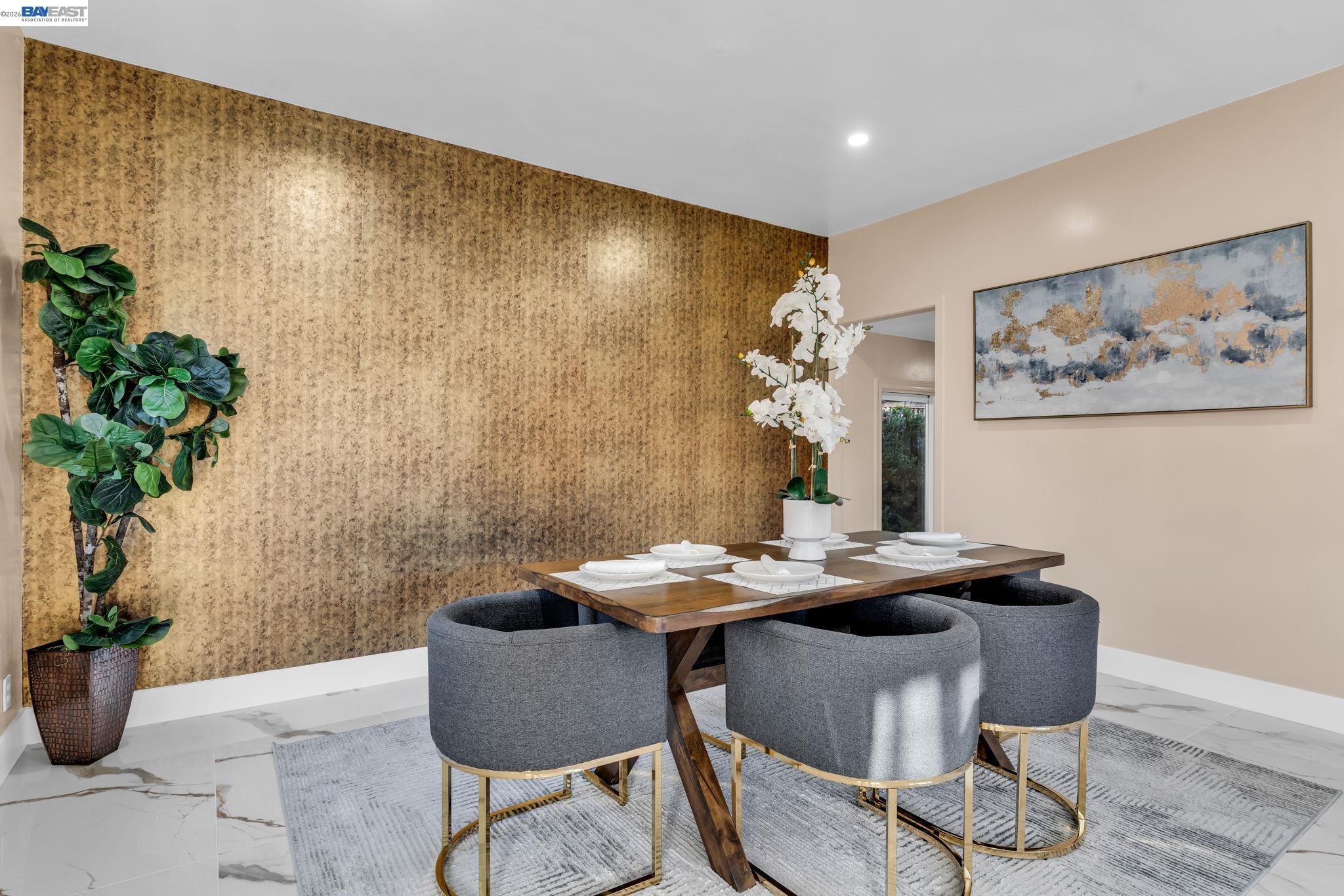 4628 Fieldbrook Road Oakland, CA 94619 - Photo 11 of 40 a dining room with furniture a potted plant and a wooden floor