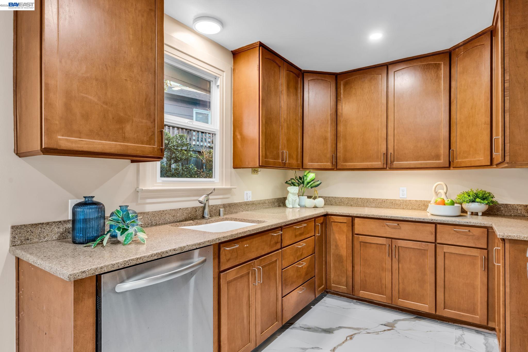 4628 Fieldbrook Road Oakland, CA 94619 - Photo 14 of 40 a kitchen with a sink cabinets and window