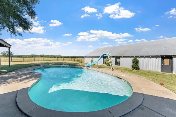 a view of a swimming pool with an ocean view