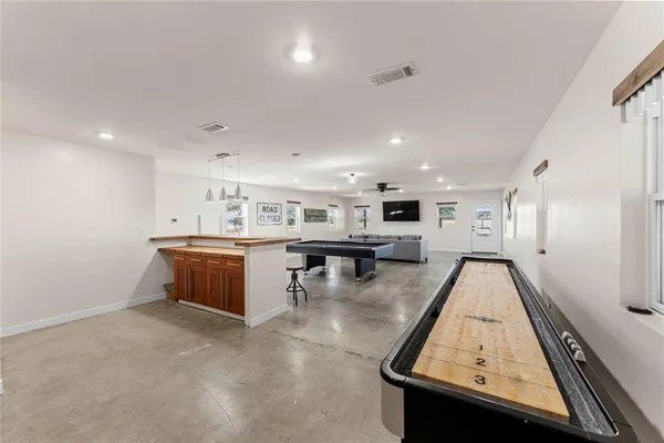 a kitchen with stainless steel appliances granite countertop a sink counter space and cabinets