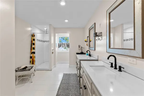 a bathroom with double vanity sink
