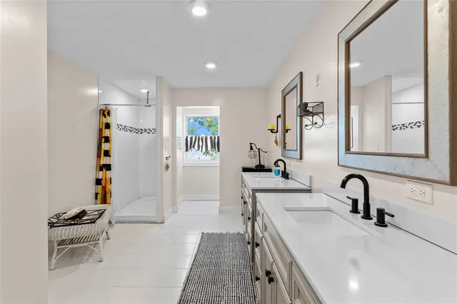 a bathroom with double vanity sink