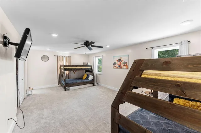 a bedroom with furniture and a window