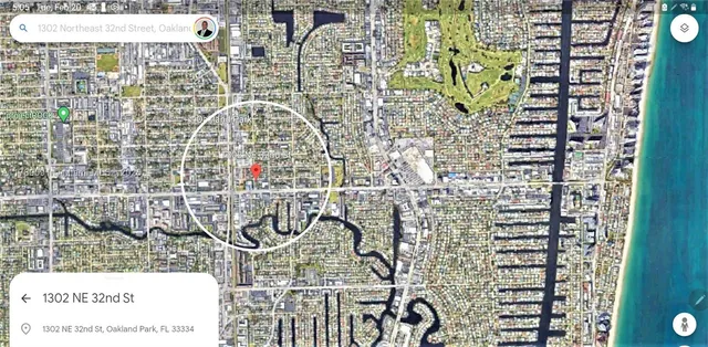 a front view of a house with plants