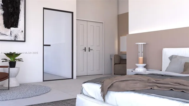 a bedroom with a bed and a potted plant