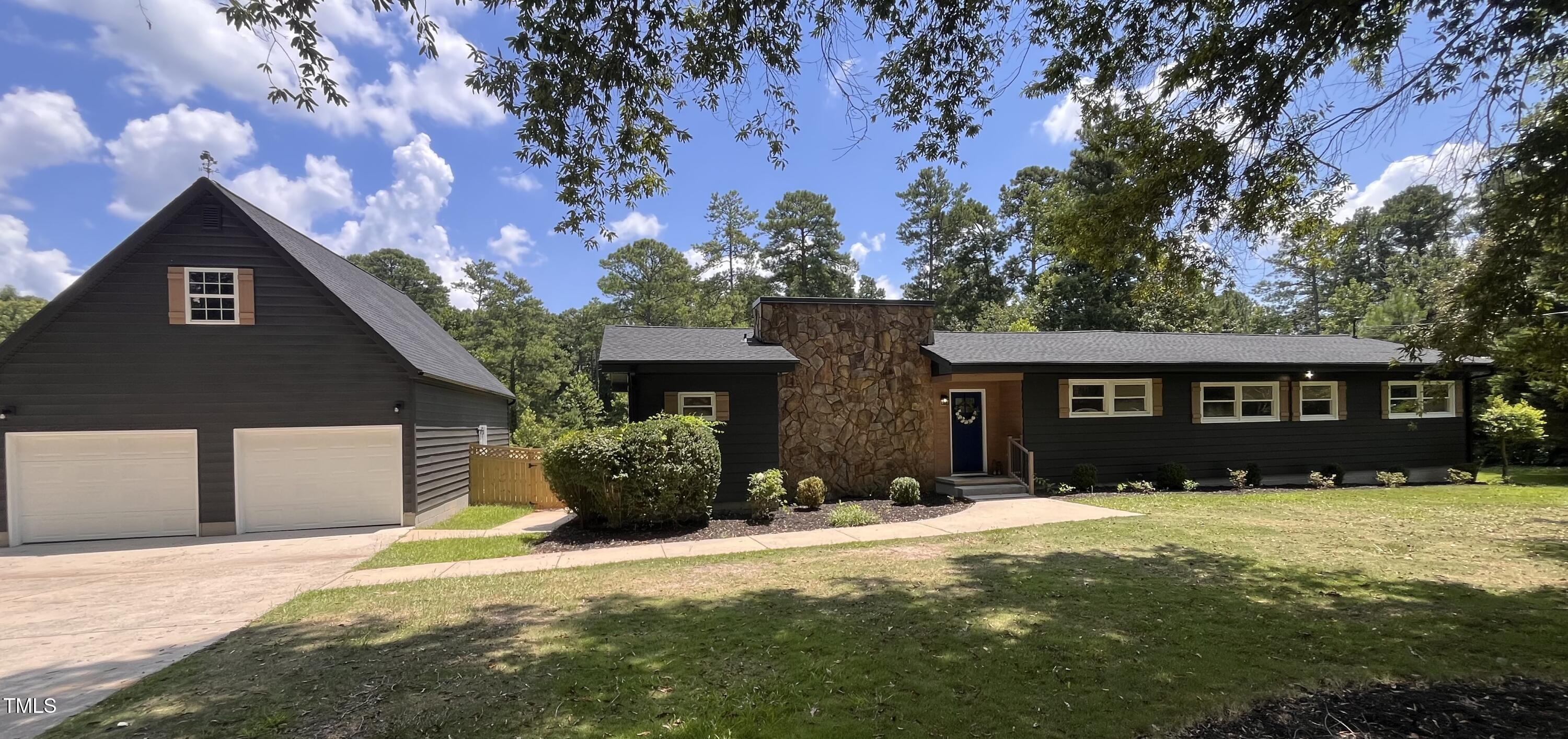6801 Holly Springs Road Raleigh, NC 27606 - Photo 1 of 34 Modernized or contemporary 50's ranch with all the charm in the world!