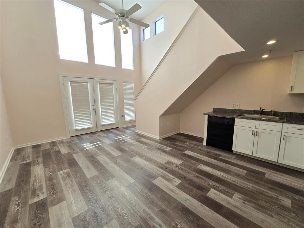 a view of a hallway with entryway and kitchen