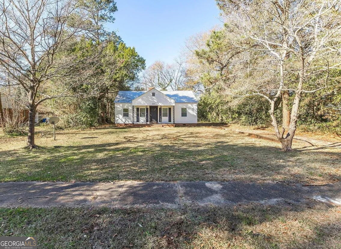 407 Forrest Drive Fort Valley, GA 31030 - Photo 1 of 1 a front view of a house with a yard