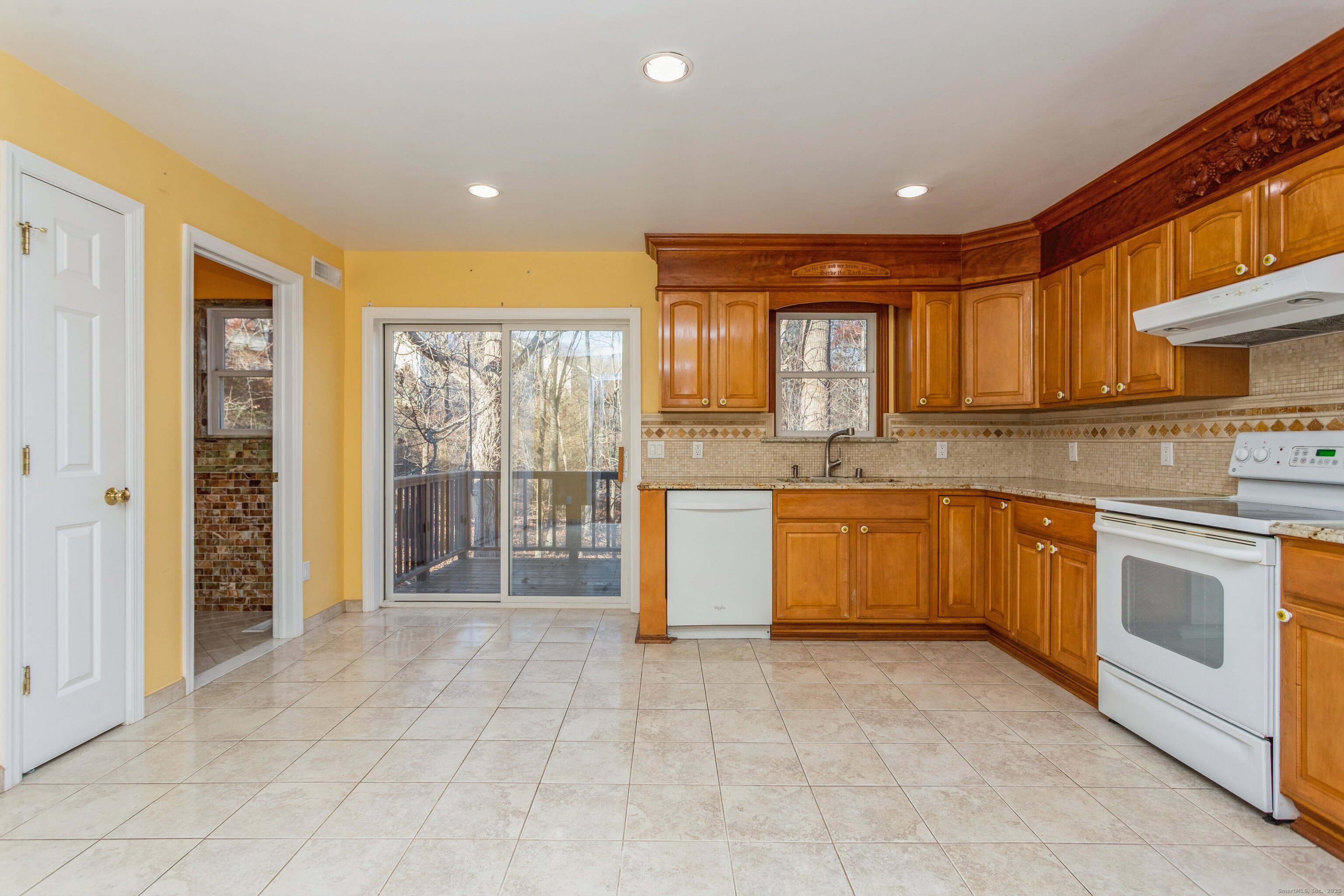 11 Scuppo Road, Unit 204 Danbury, CT 06811 - Photo 2 of 17 a kitchen with stainless steel appliances granite countertop a stove sink and cabinets