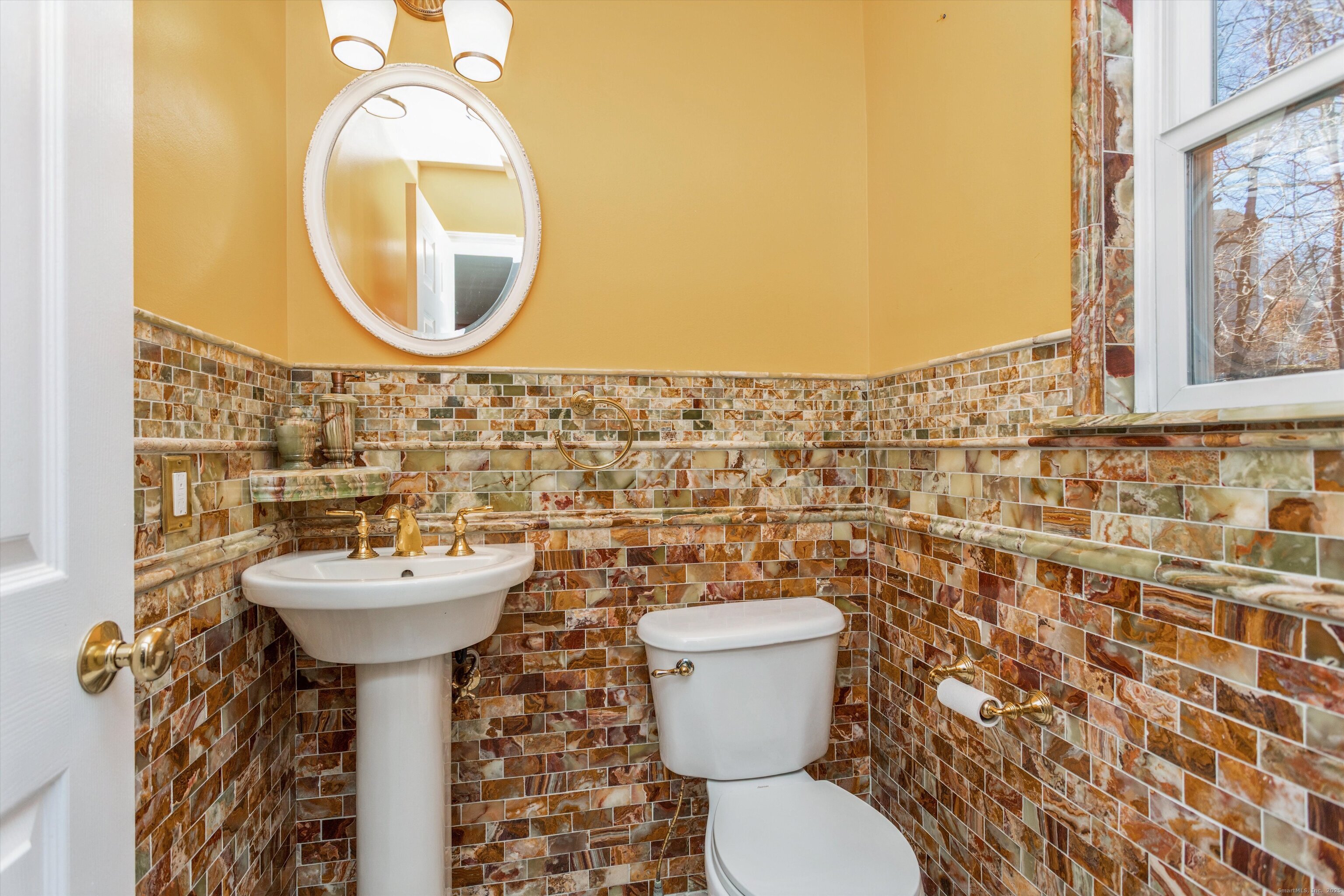 11 Scuppo Road, Unit 204 Danbury, CT 06811 - Photo 7 of 17 a bathroom with a sink mirror and toilet