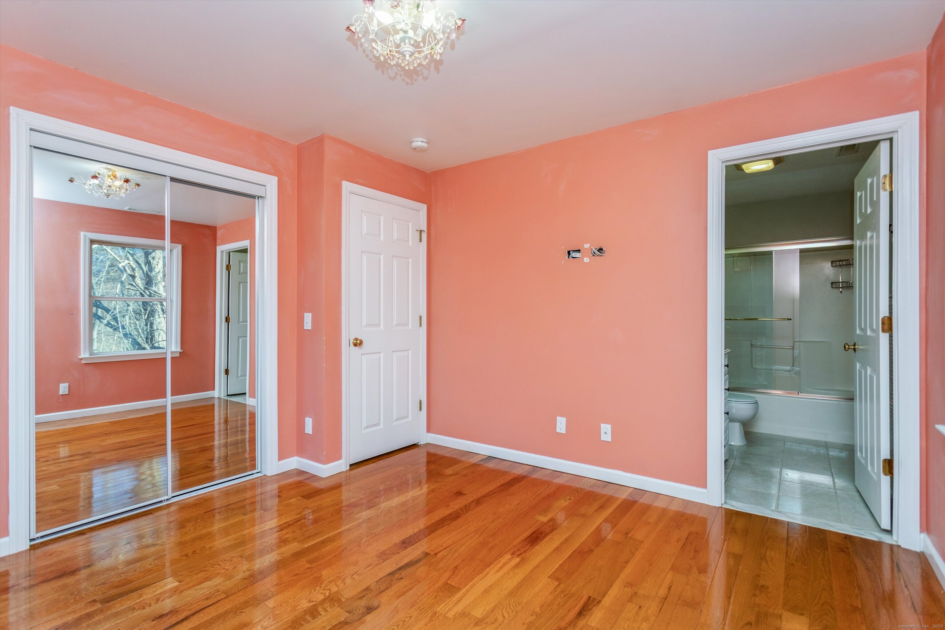 11 Scuppo Road, Unit 204 Danbury, CT 06811 - Photo 8 of 17 wooden floor in an empty room with a window