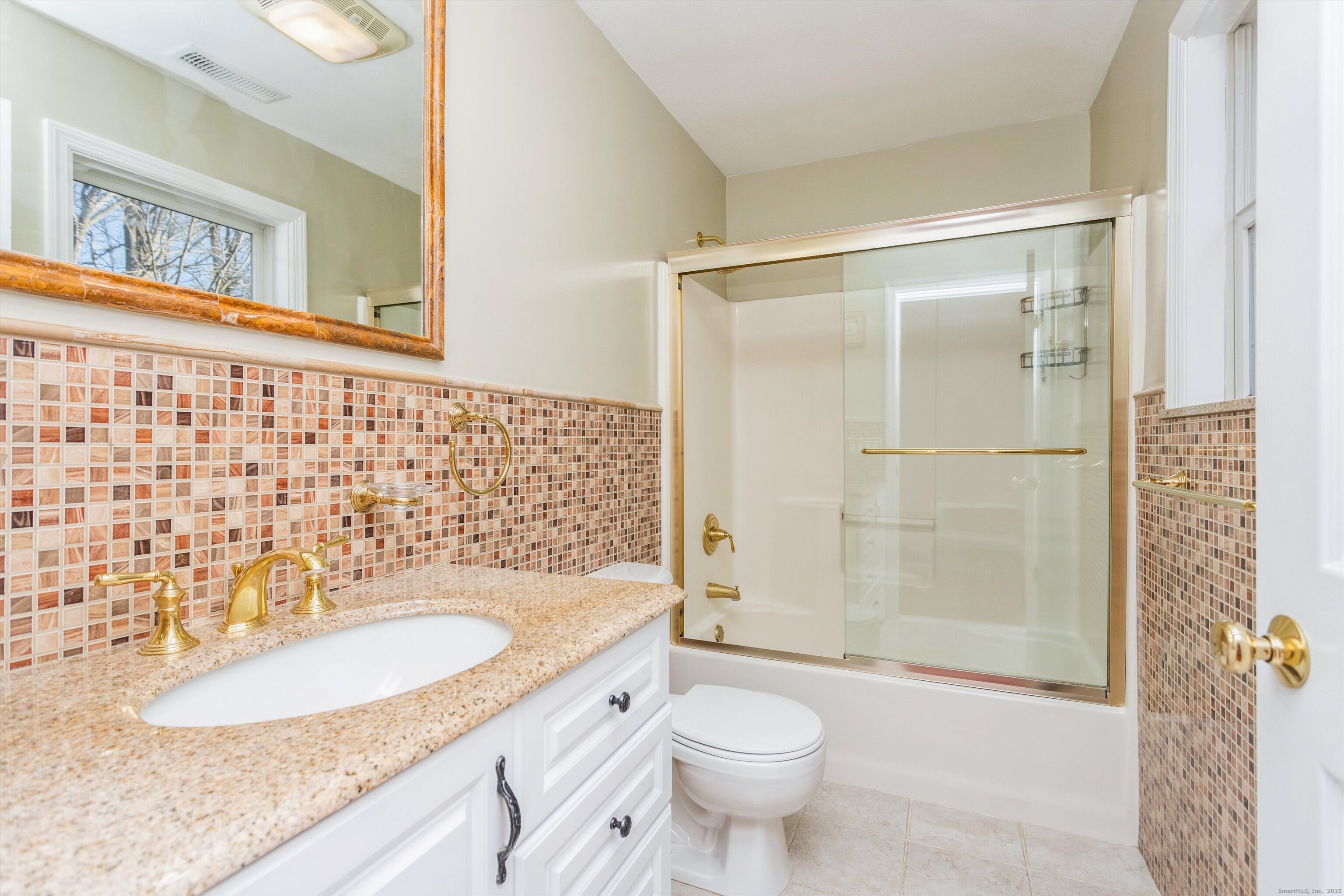 11 Scuppo Road, Unit 204 Danbury, CT 06811 - Photo 9 of 17 a bathroom with a sink toilet a mirror and shower