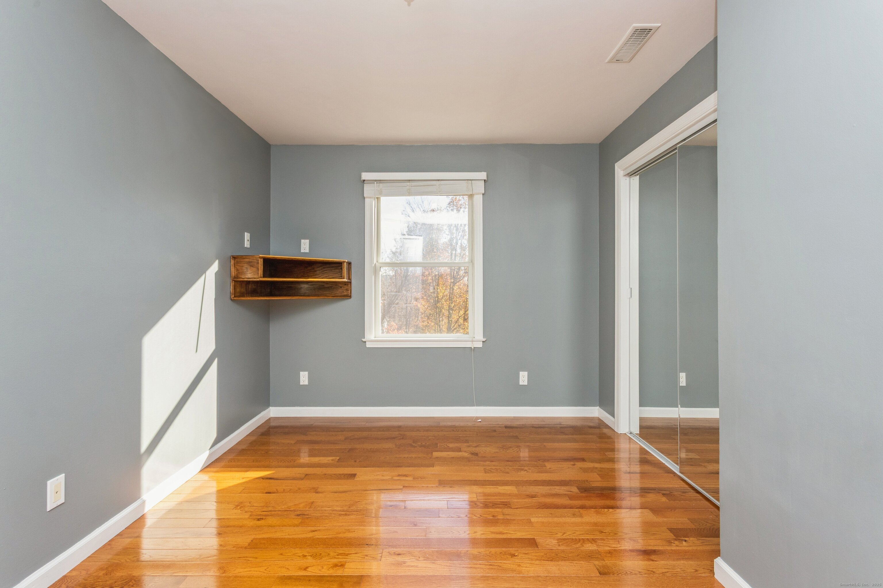11 Scuppo Road, Unit 204 Danbury, CT 06811 - Photo 10 of 17 a view of empty room with wooden floor
