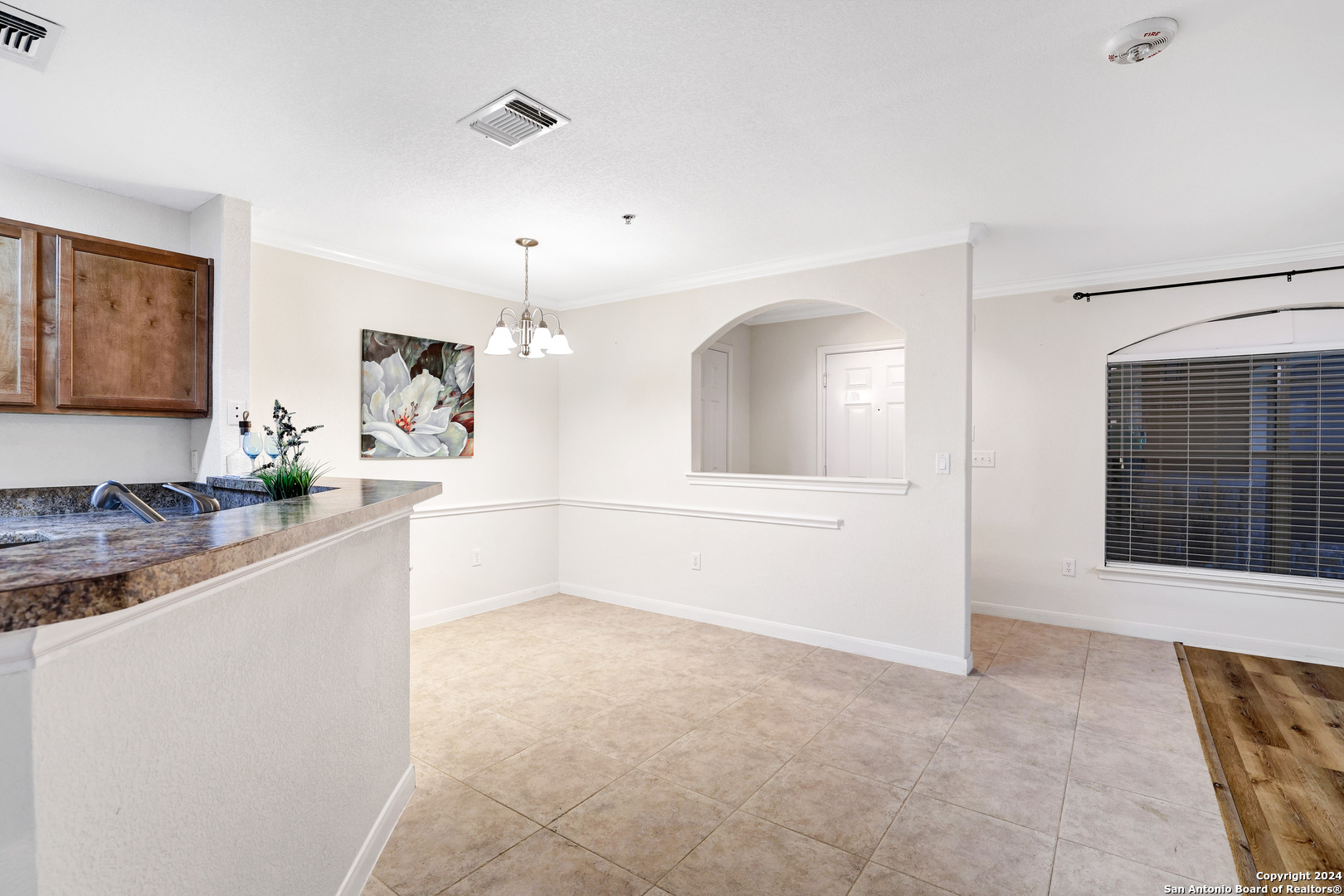 7323 Snowden Road, Unit 3108 San Antonio, TX 78240 - Photo 13 of 34 a living room with stainless steel appliances kitchen island granite countertop furniture and a fireplace