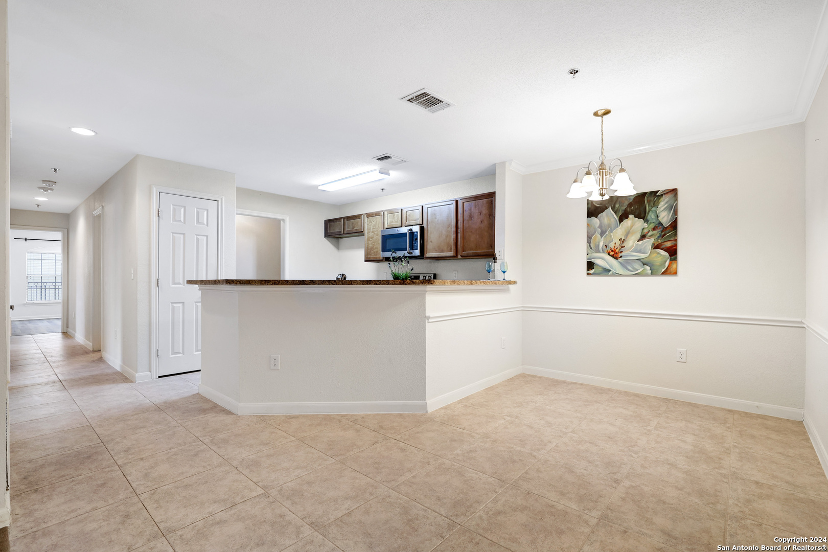 7323 Snowden Road, Unit 3108 San Antonio, TX 78240 - Photo 14 of 34 a kitchen with stainless steel appliances granite countertop a refrigerator a stove a sink dishwasher and a refrigerator with wooden floor