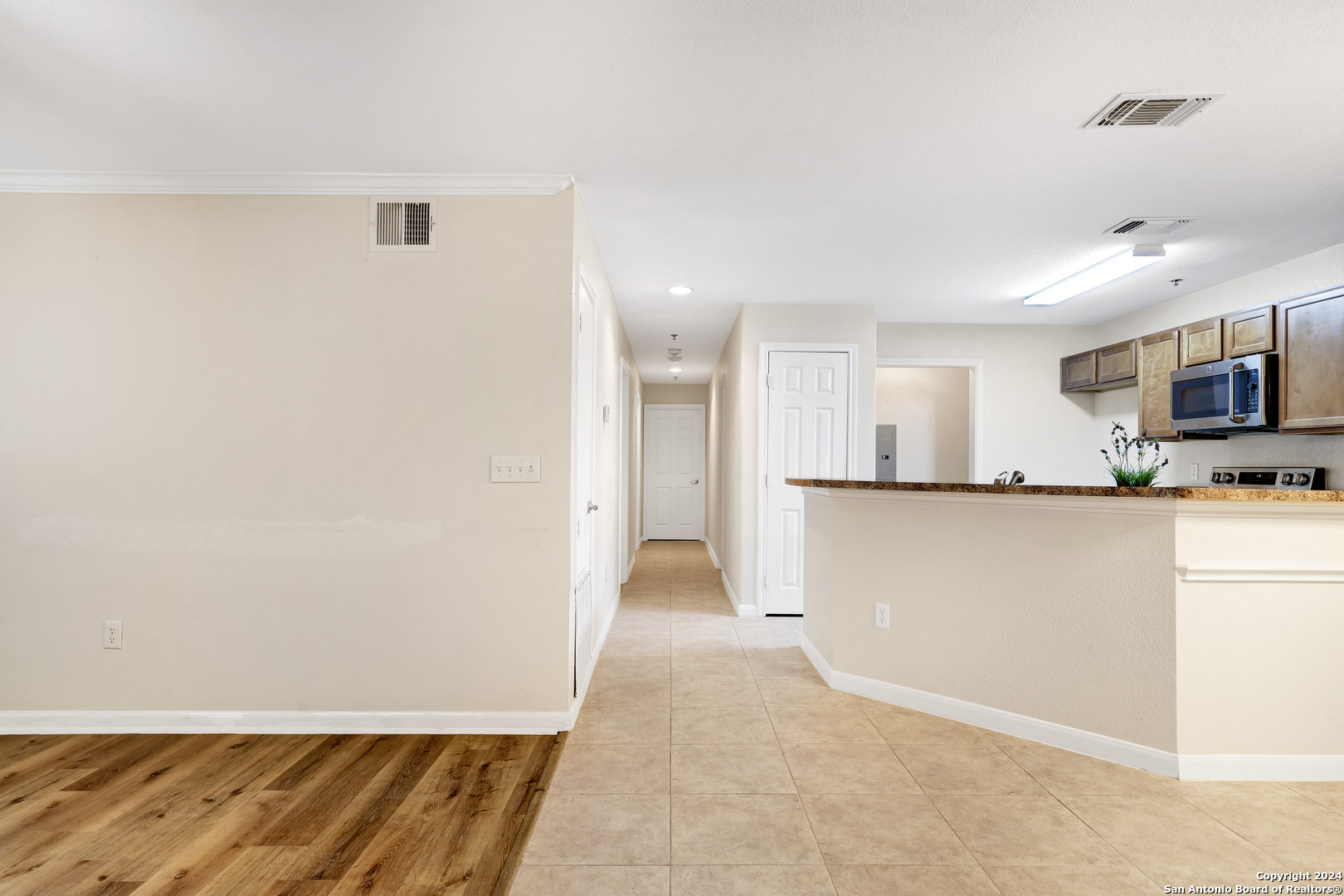 7323 Snowden Road, Unit 3108 San Antonio, TX 78229 - Photo 14 of 31 a view of kitchen with wooden floor
