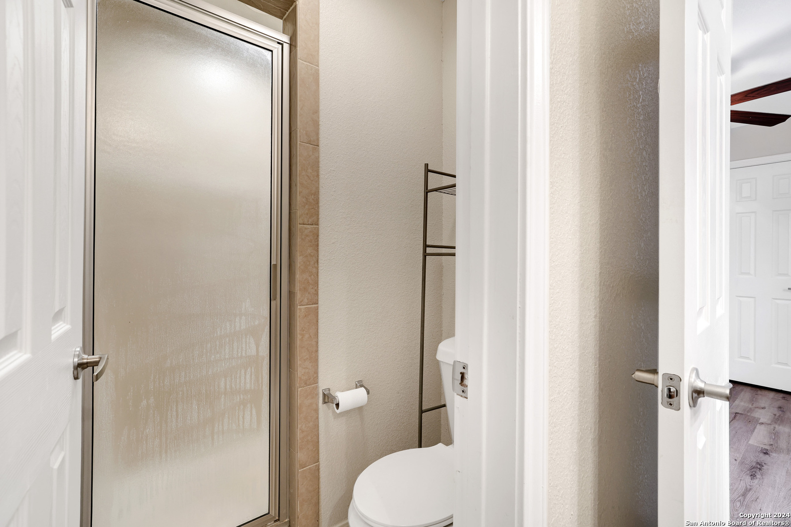 7323 Snowden Road, Unit 3108 San Antonio, TX 78229 - Photo 28 of 31 a bathroom with a shower and a toilet