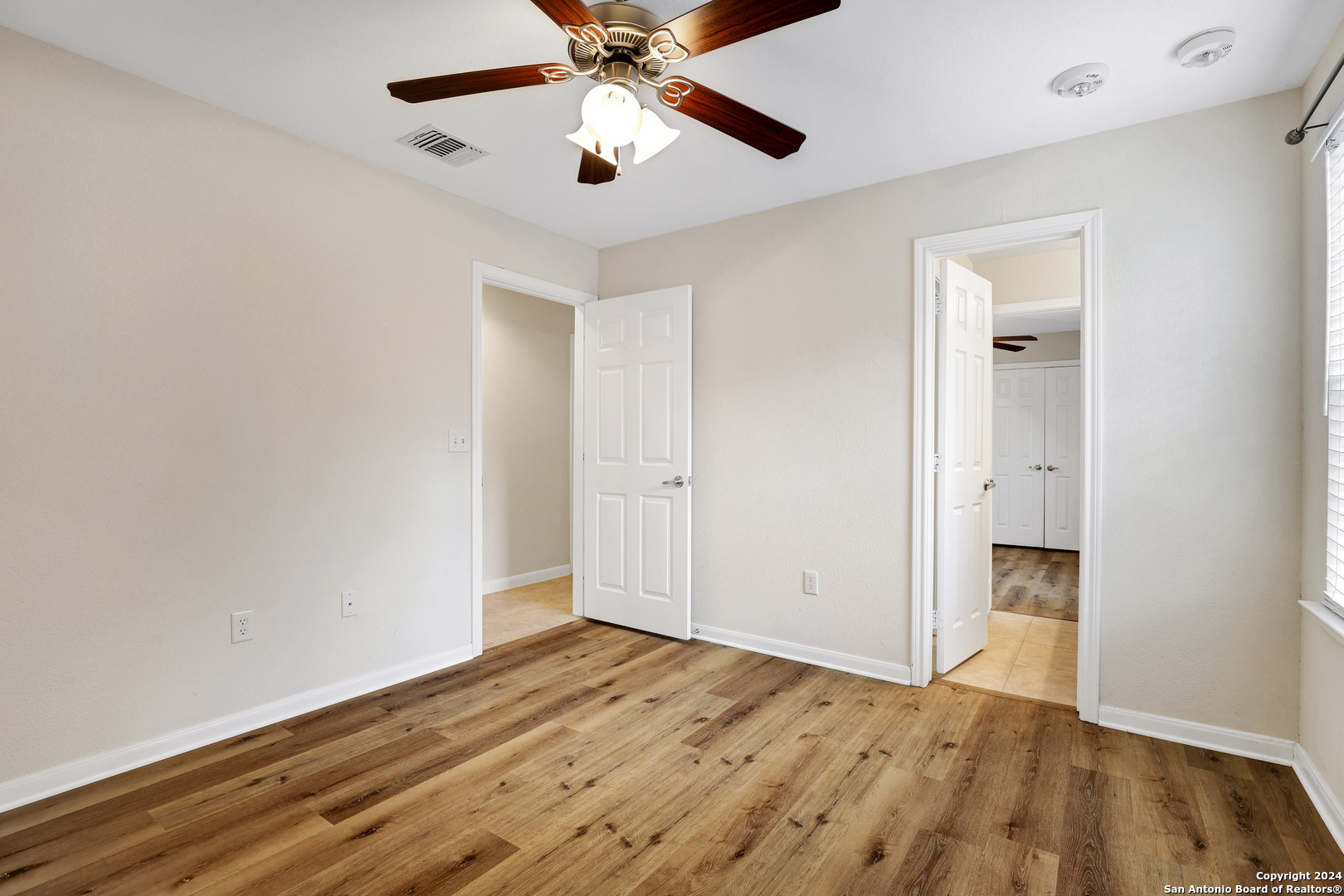 7323 Snowden Road, Unit 3108 San Antonio, TX 78240 - Photo 30 of 34 wooden floor in an empty room