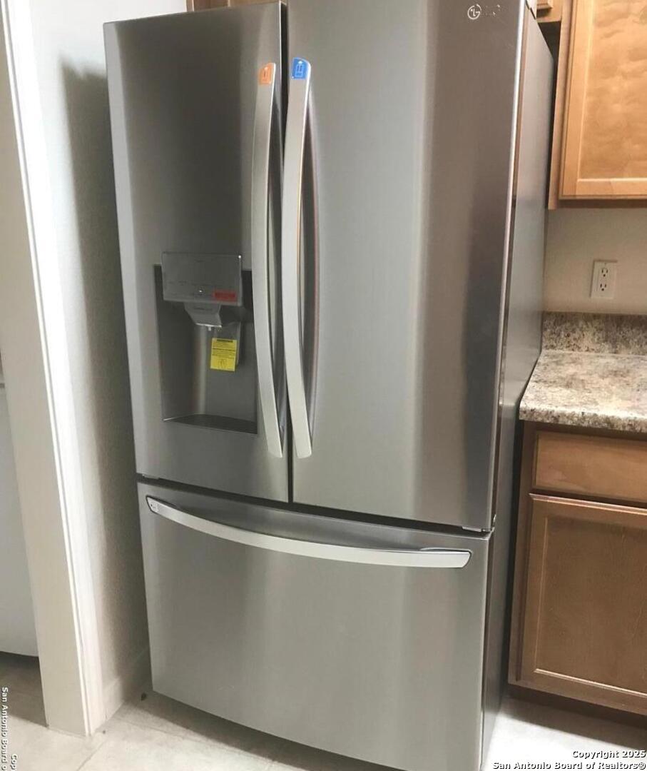 7323 Snowden Road, Unit 3108 San Antonio, TX 78240 - Photo 6 of 34 a view of a refrigerator in kitchen