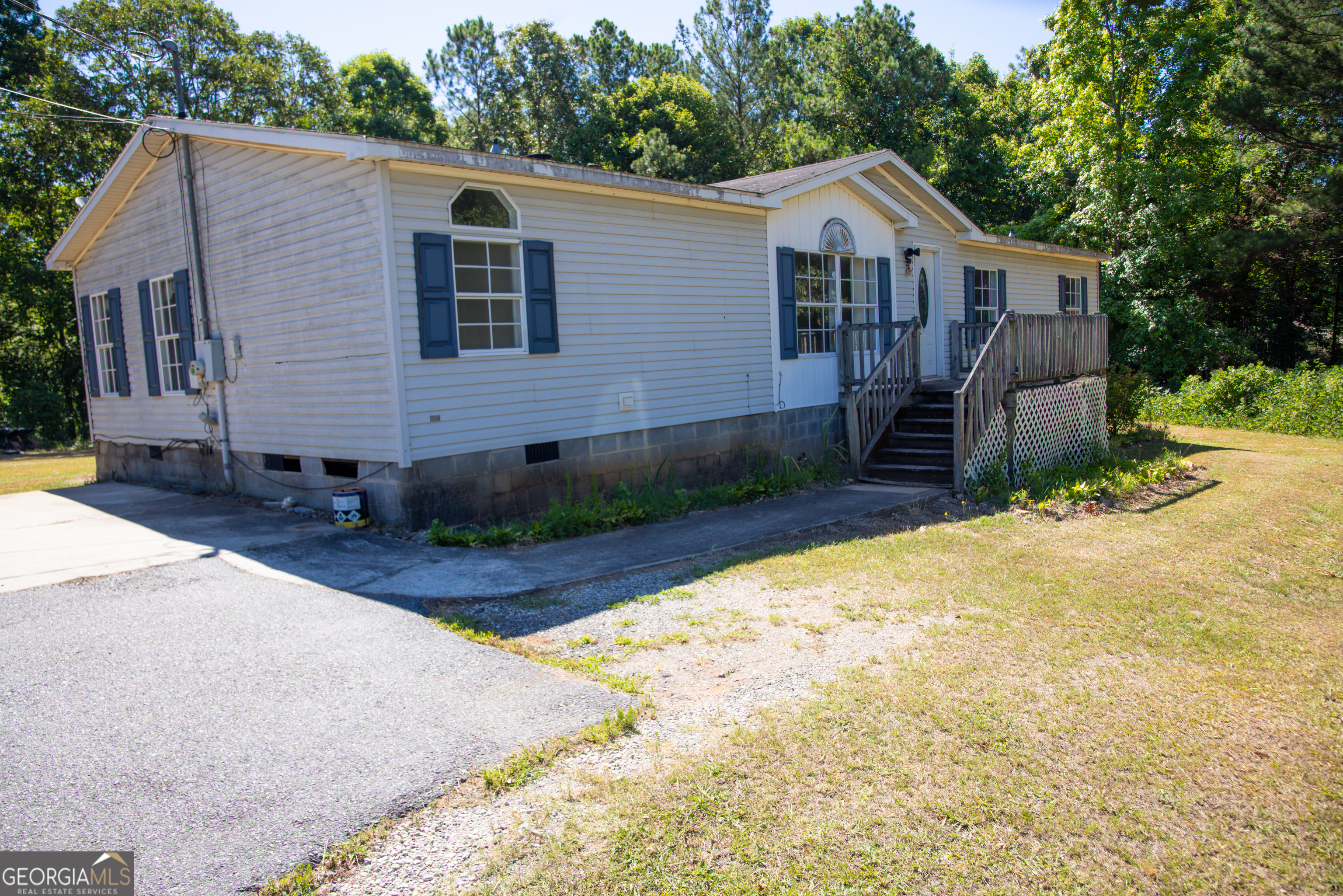 4687 Boxankle Road Jackson, GA 30233 - Photo 1 of 1 a view of a house with a yard and large tree