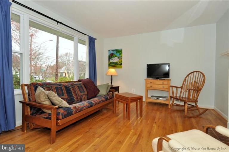 10405 Procter Street Silver Spring, MD 20901 - Photo 3 of 27 a living room with furniture and a flat screen tv