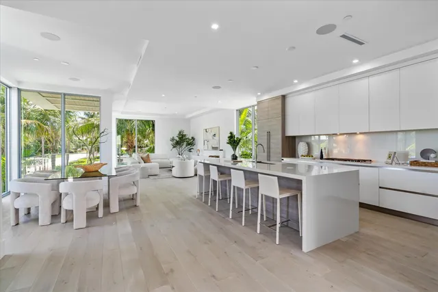 a kitchen with lots of counter top space and living room