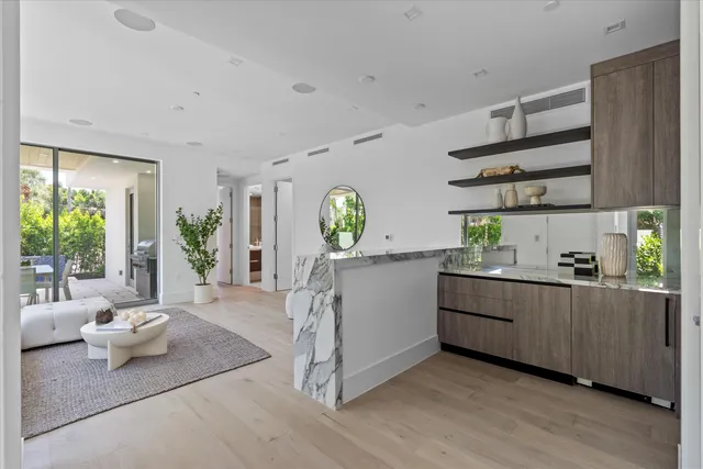 a kitchen with stainless steel appliances kitchen island granite countertop a stove and cabinets
