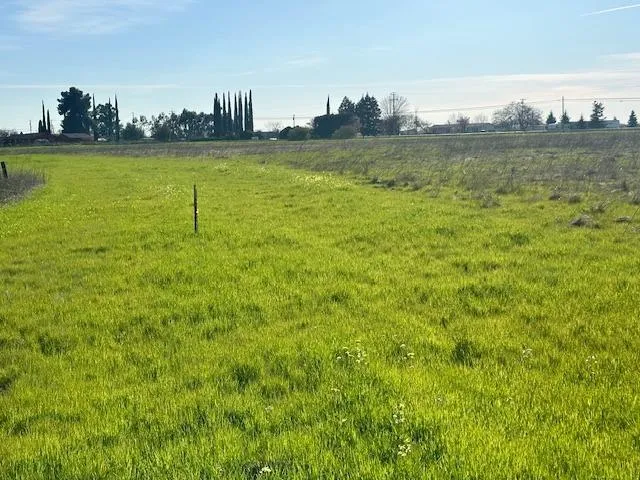 a view of a ocean with a large building in the back