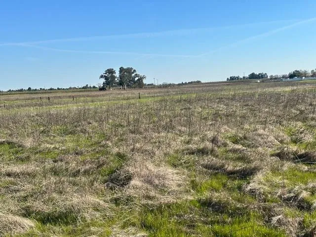 a view of a large body of water with a building in the background