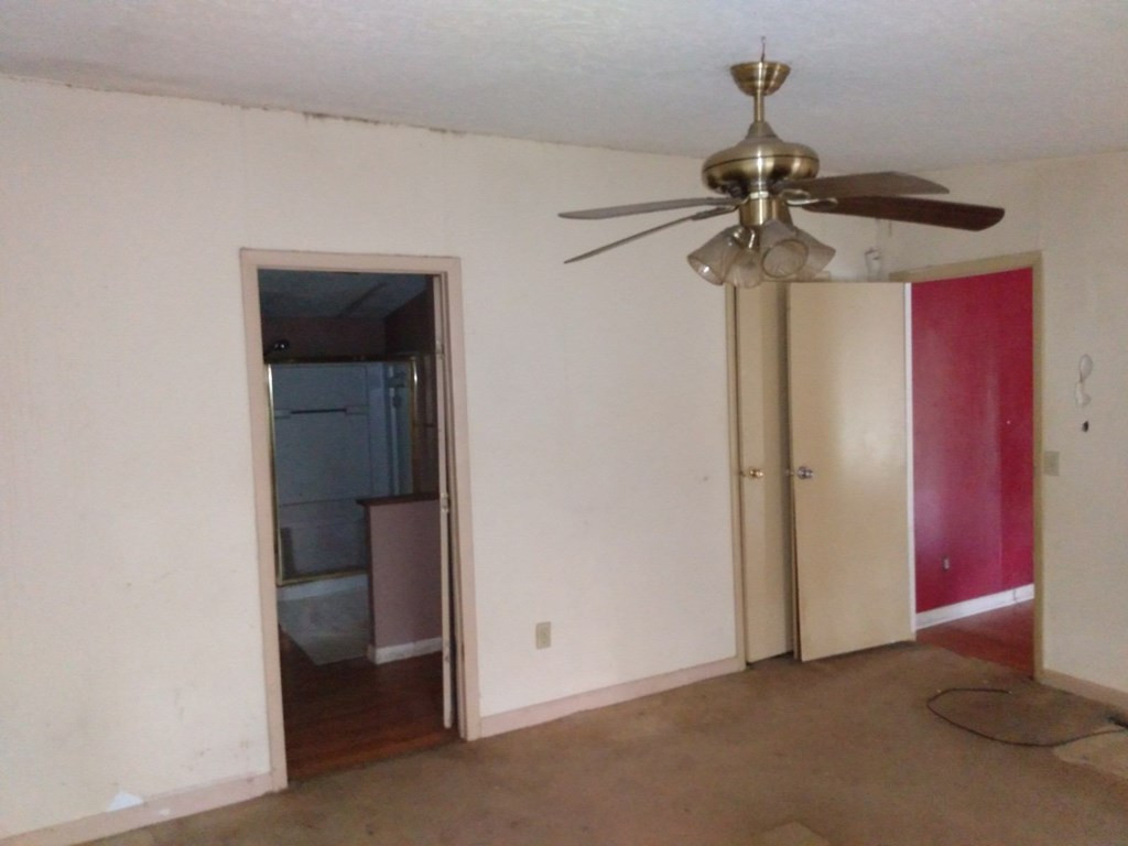 567 Cedar Road Aiken, SC 29803 - Photo 9 of 25 a view of a room with a hanging light and a ceiling fan