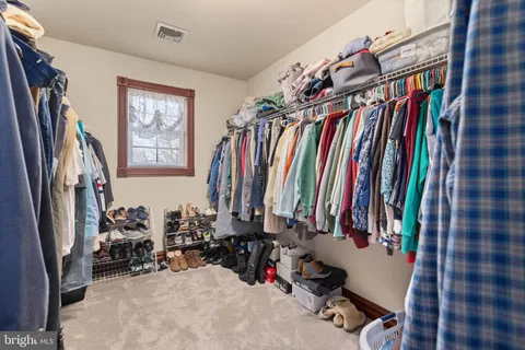 a view of a closet with storage