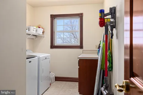 a bathroom with a sink toilet and a mirror