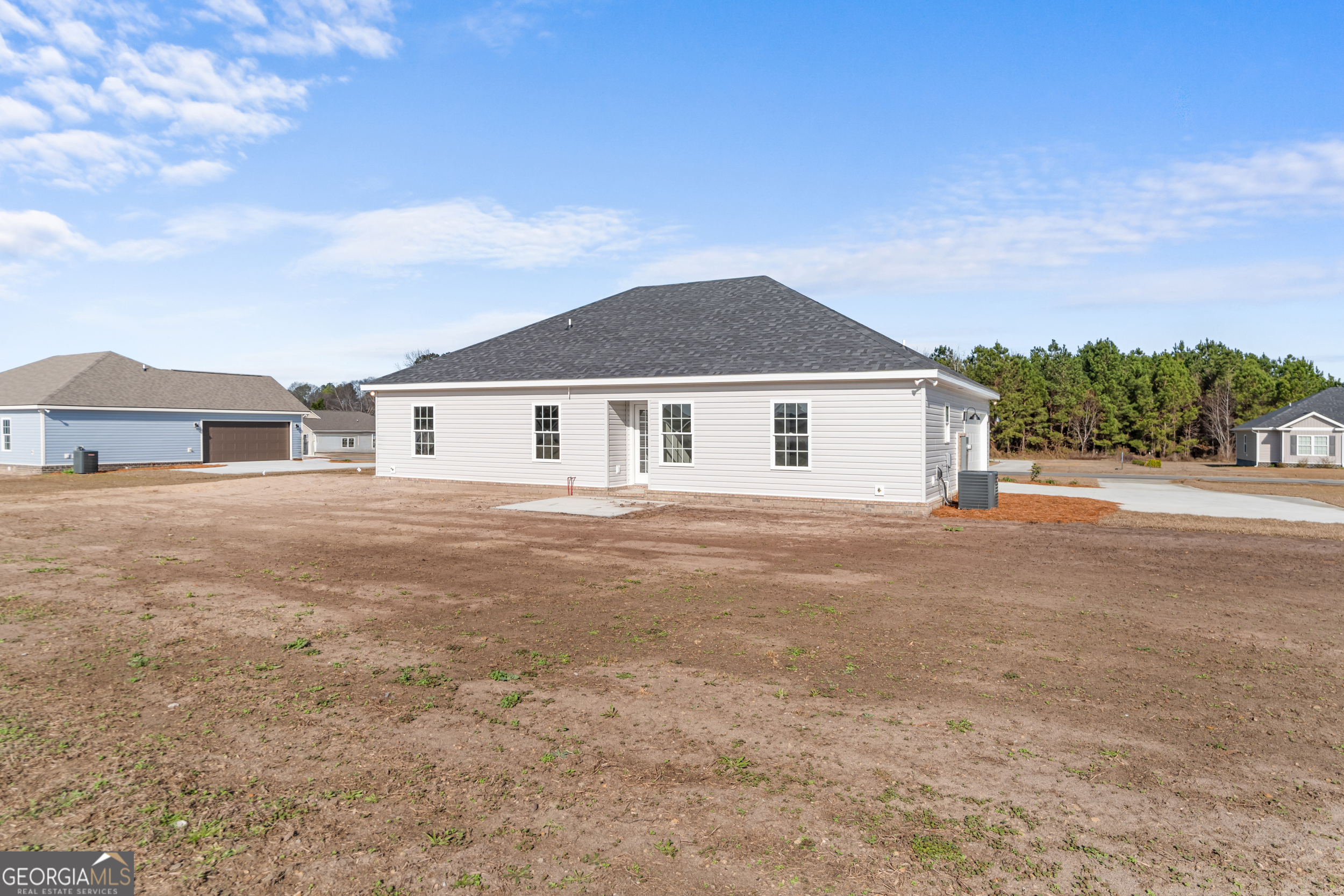 110 Enclave Court Statesboro, GA 30458 - Photo 15 of 16 a front view of a house with a garden